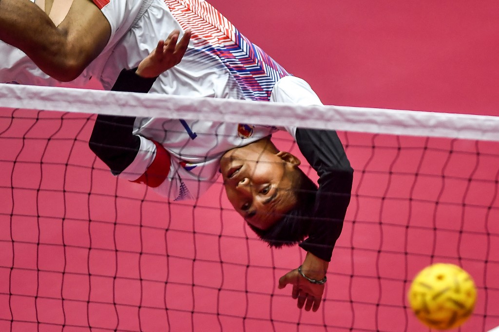 Philippines' Jason D. Huerte kicks the ball during the sepak takraw men's match Asian games