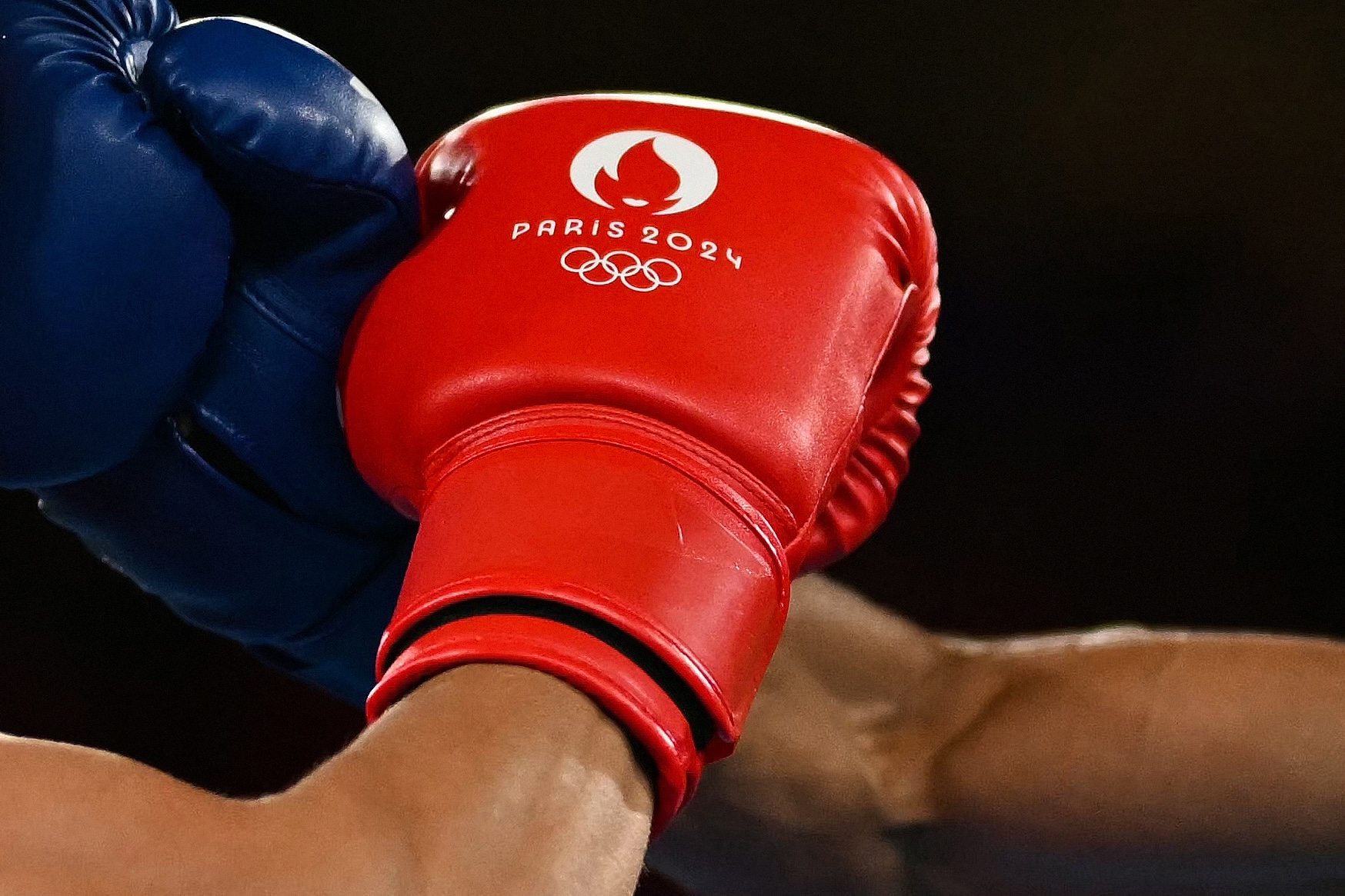 (FILES) Kyrgyzstan's Munarbek Seiitbek Uulu and Bulgaria's Javier Ibanez Diaz (Blue) compete in the men's 57kg semi-final boxing match during the Paris 2024 Olympic Games at the Roland-Garros Stadium, in Paris on August 8, 2024. The International Olympic Committee on February 26, 2025 provisionally recognised the recently created World Boxing as the body to oversee the sport at future Games. The IOC severed links with the International Boxing Association (IBA), the long-standing ruling body of amateur boxing, over financial, governance and ethical concerns and took over the organisation of the sport at last year's Paris Olympics.