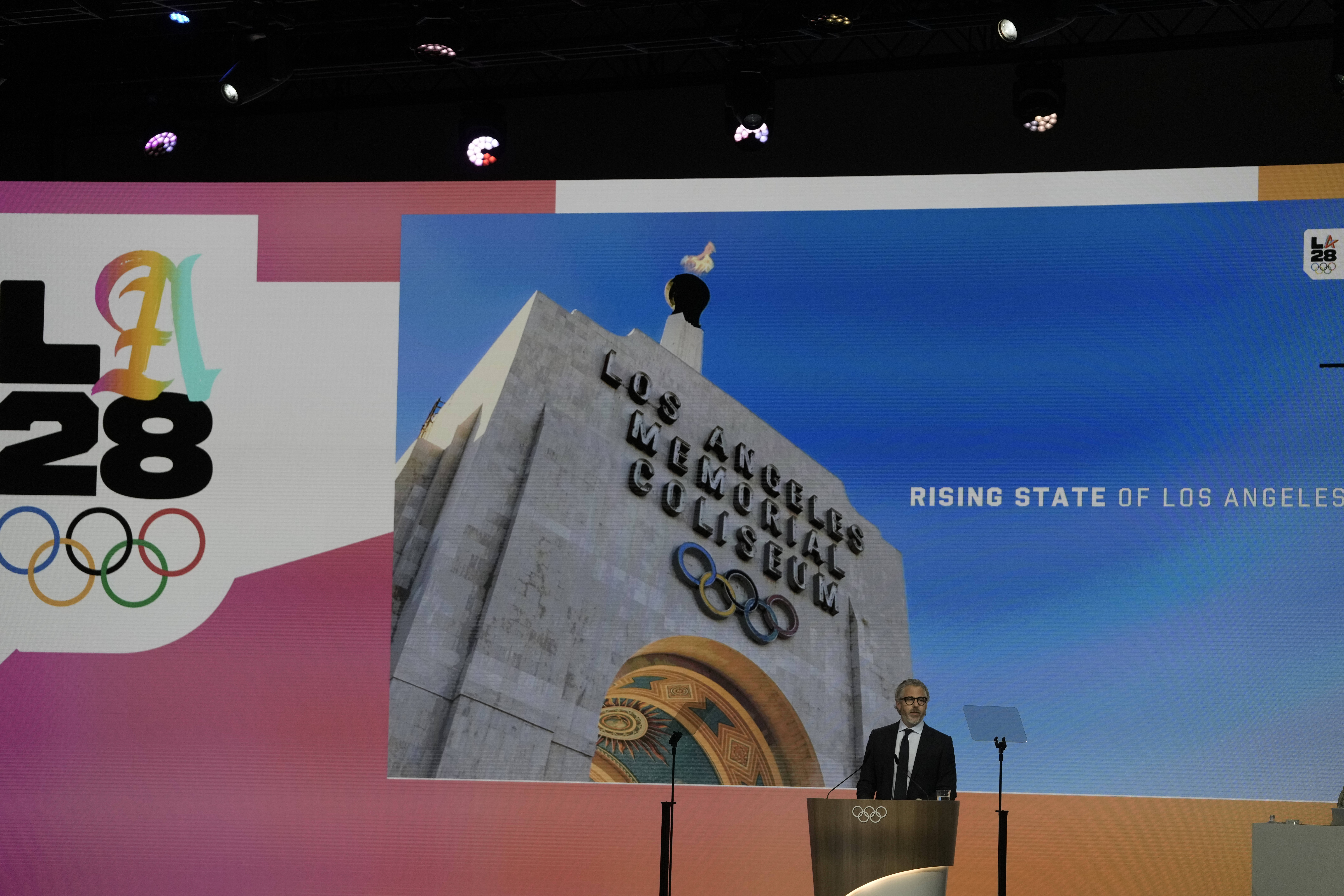 Casey Wasserman, chairman of the 2028 Los Angeles Olympics organizing committee, speaks during the 144th International Olympic Committee session, which will elect the new IOC President, in Costa Navarino, western Greece, Thursday, March 20, 2025.