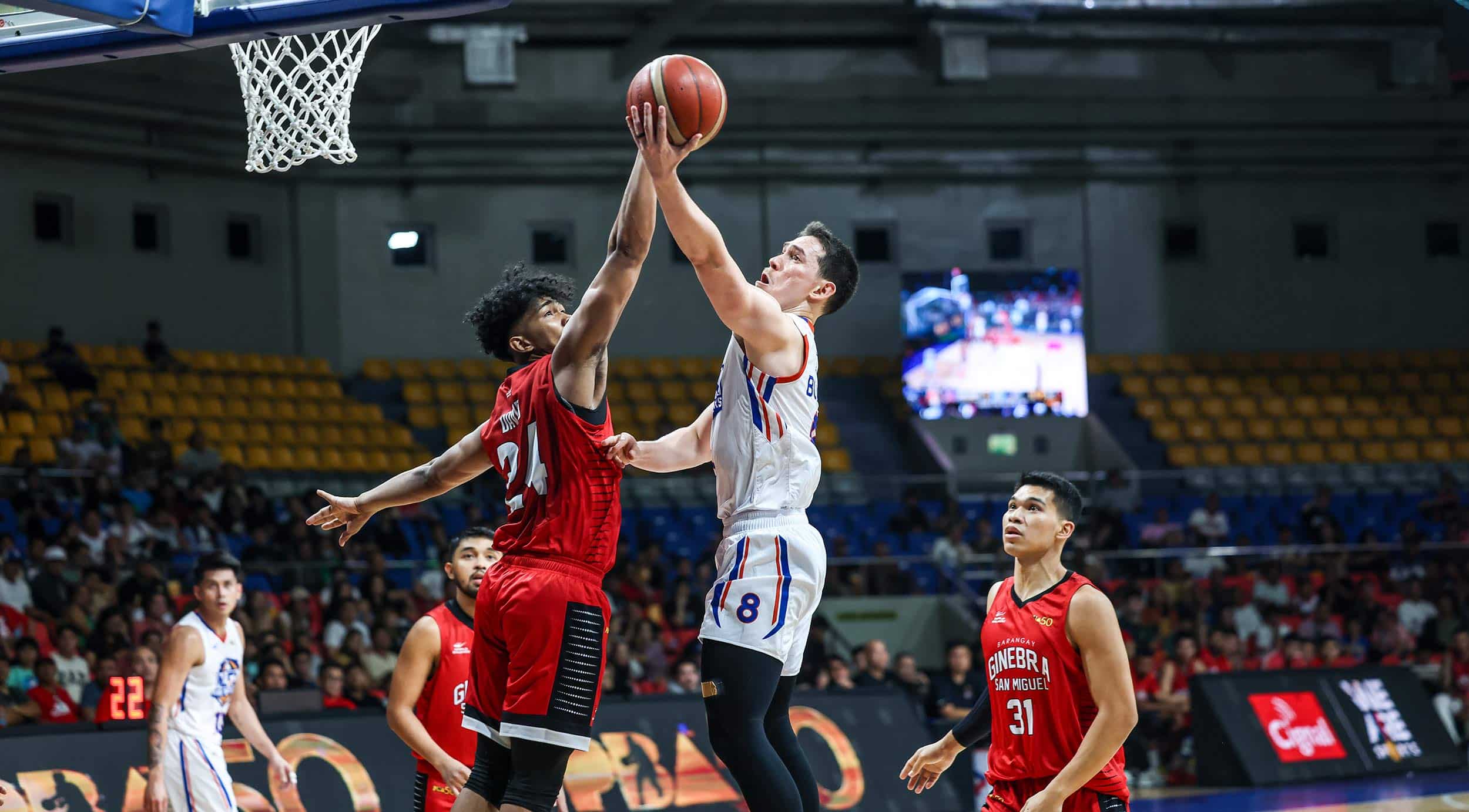 NLEX Road Warriors' Robert Bolick against Barangay Ginebra defenders during a PBA Philippine Cup game