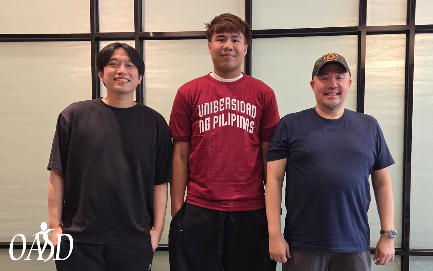 UP Fighting Maroons' assistant coach Tom Chua, transferee Veejay Pre, head coach Goldwin Monteverde.